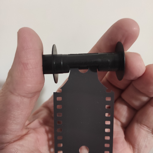 35mm Movie Reel And Scissors For The Final Cut Stock Photo